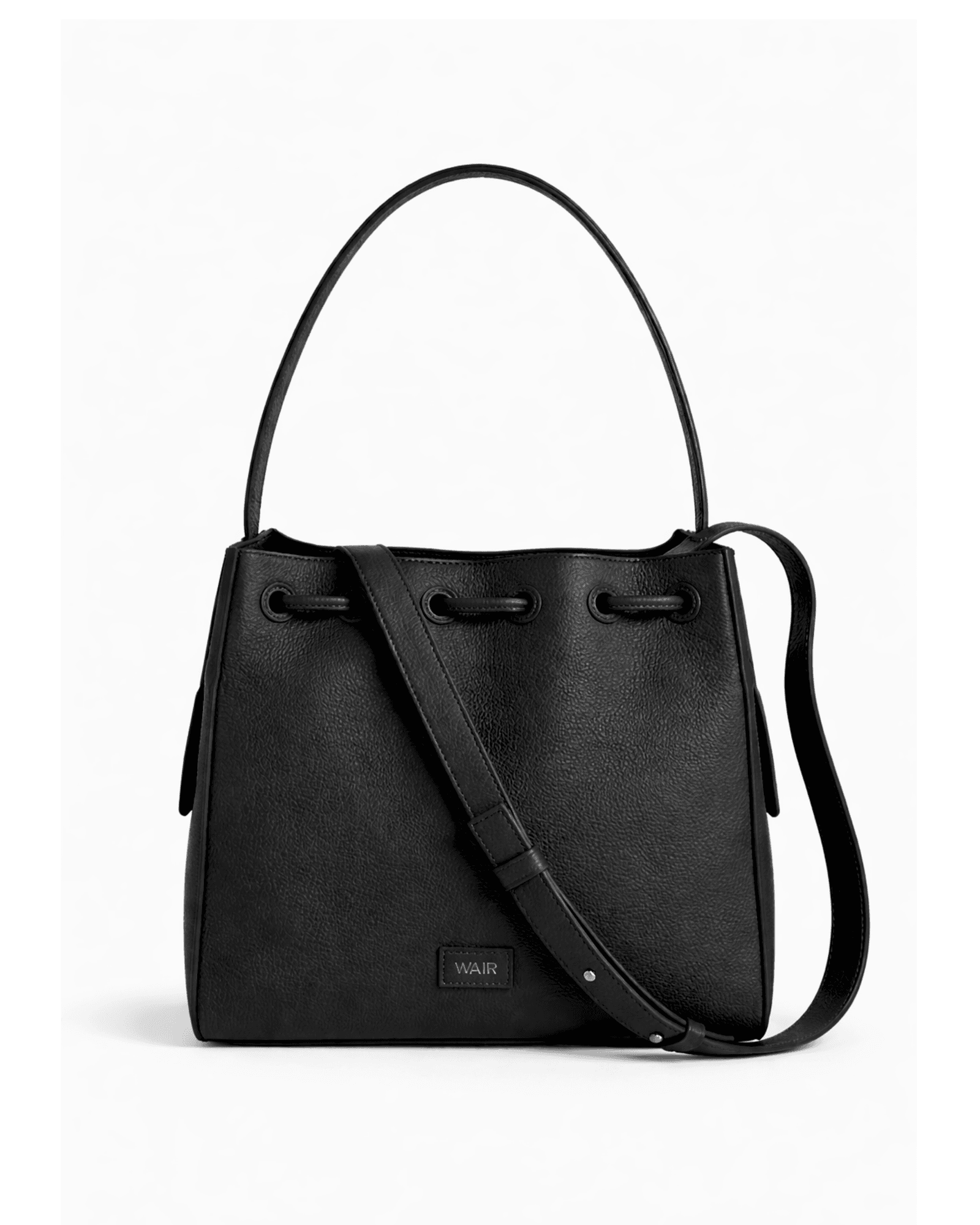 The Cove carried in editorial light — WAIR Studio leather